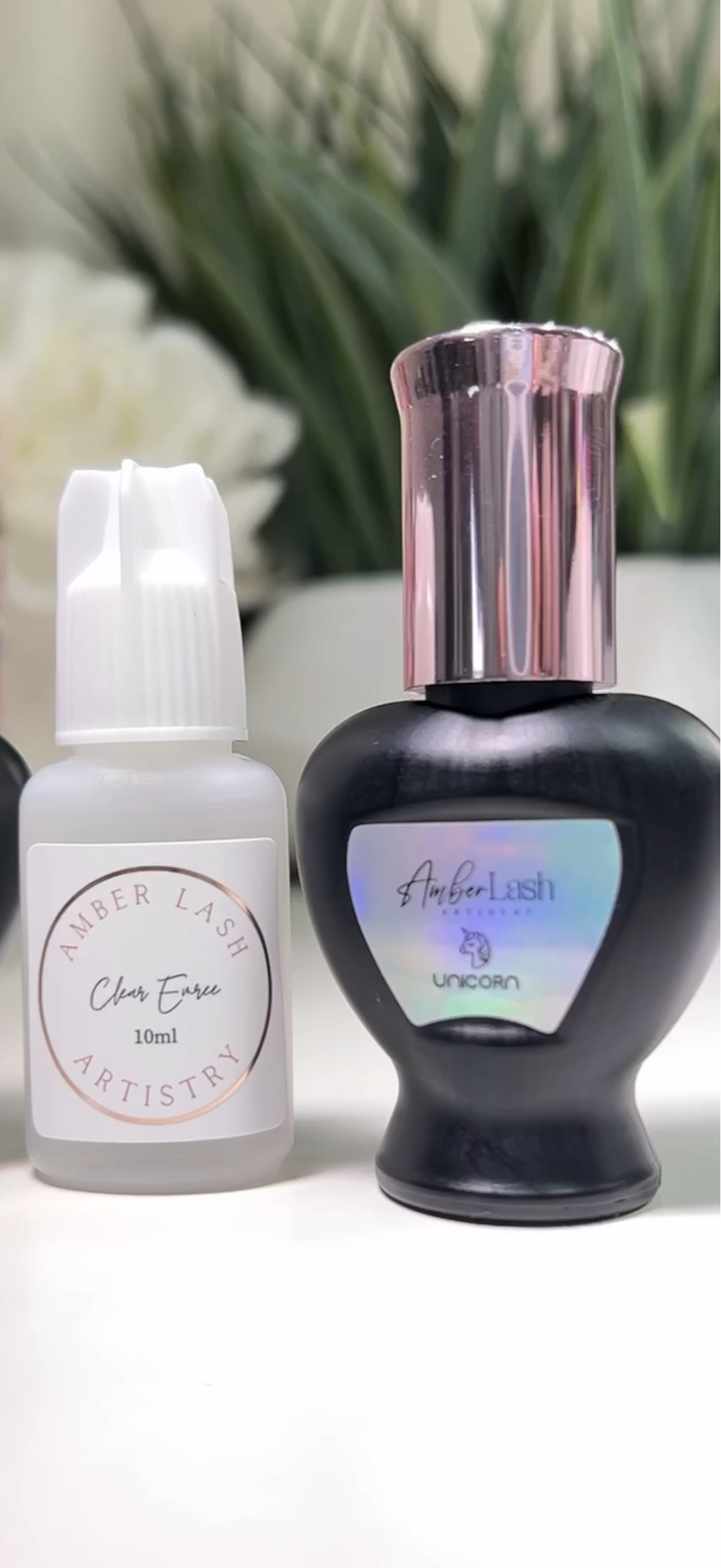 Unicorn lash adhesive heart-shaped black bottle with holographic label